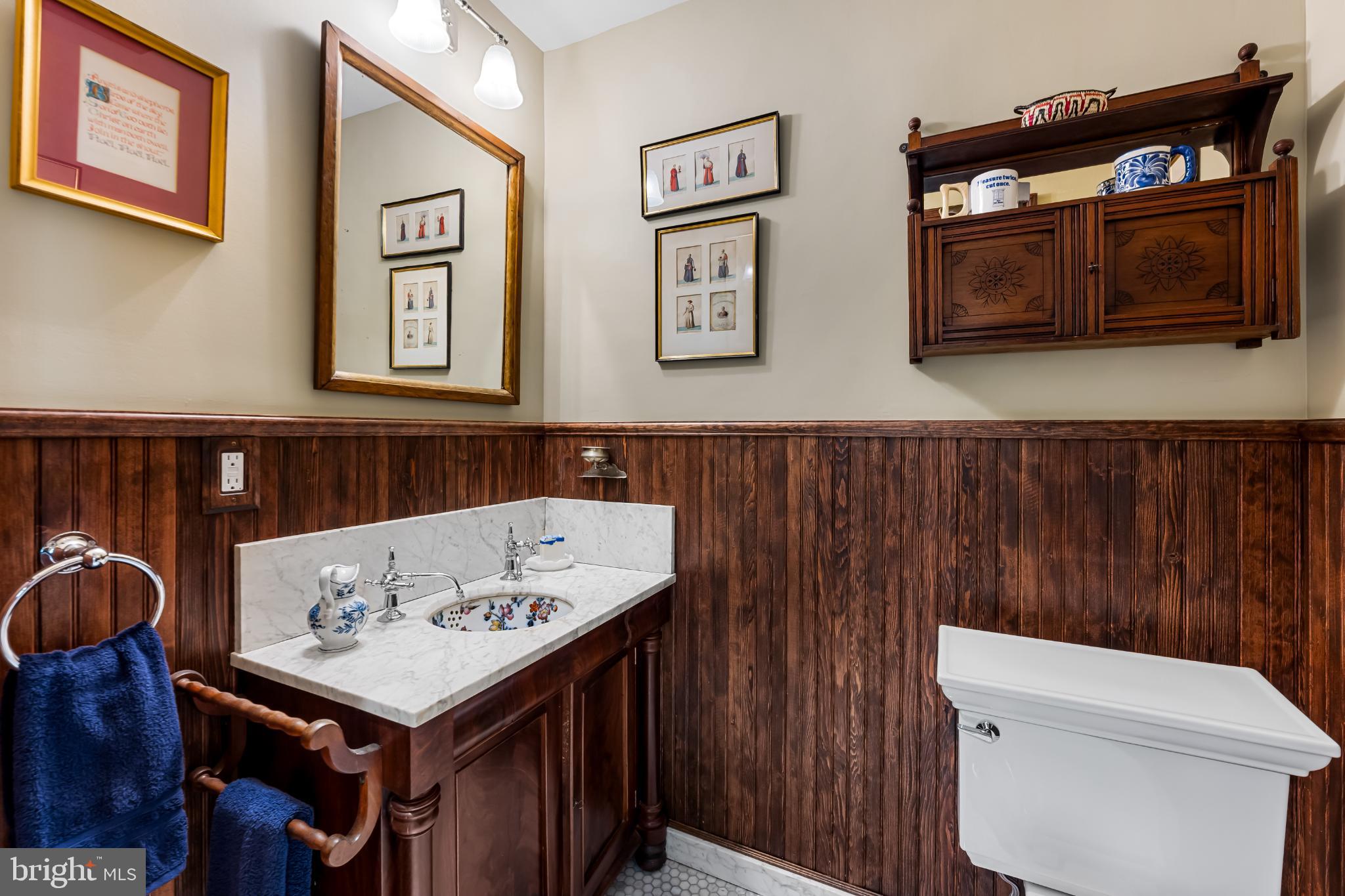 407 Warren Avenue Baltimore, MD 21230 - Photo 44 of 85 a bathroom with a sink a toilet and mirror