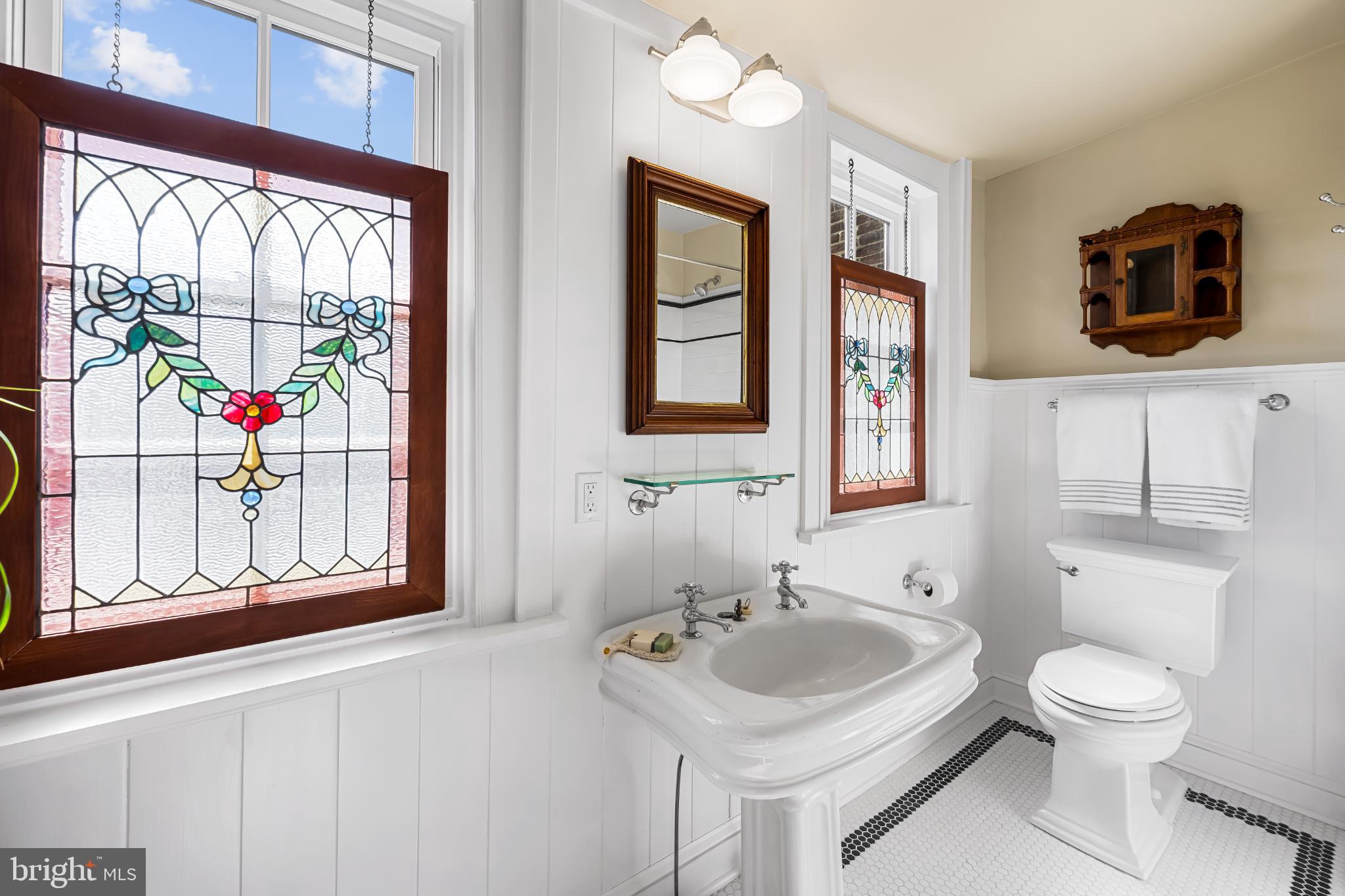 407 Warren Avenue Baltimore, MD 21230 - Photo 48 of 85 a bathroom with a sink a mirror and a toilet