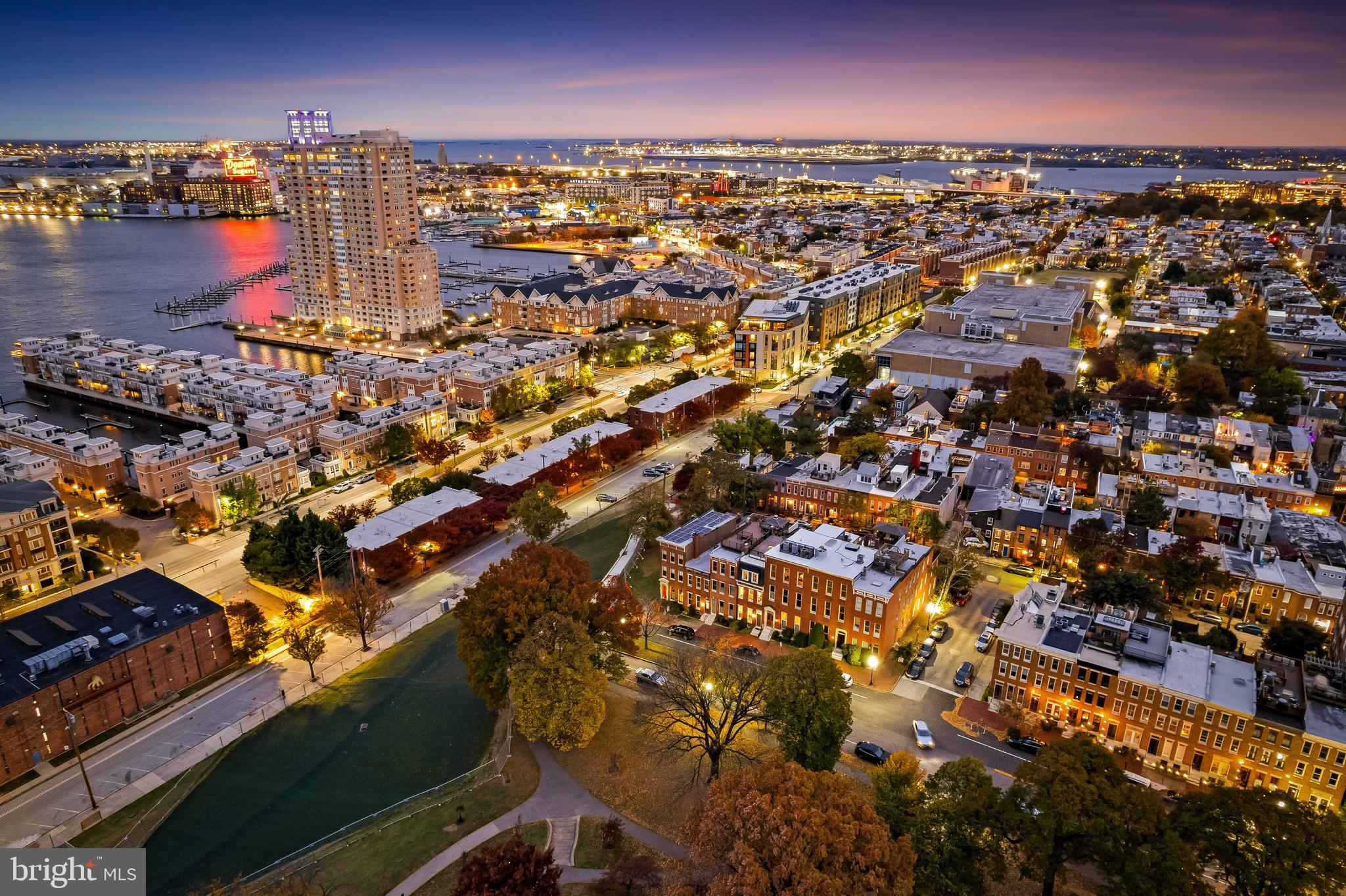 407 Warren Avenue Baltimore, MD 21230 - Photo 83 of 85 an aerial view of a city with lots of residential buildings ocean and mountain view in back