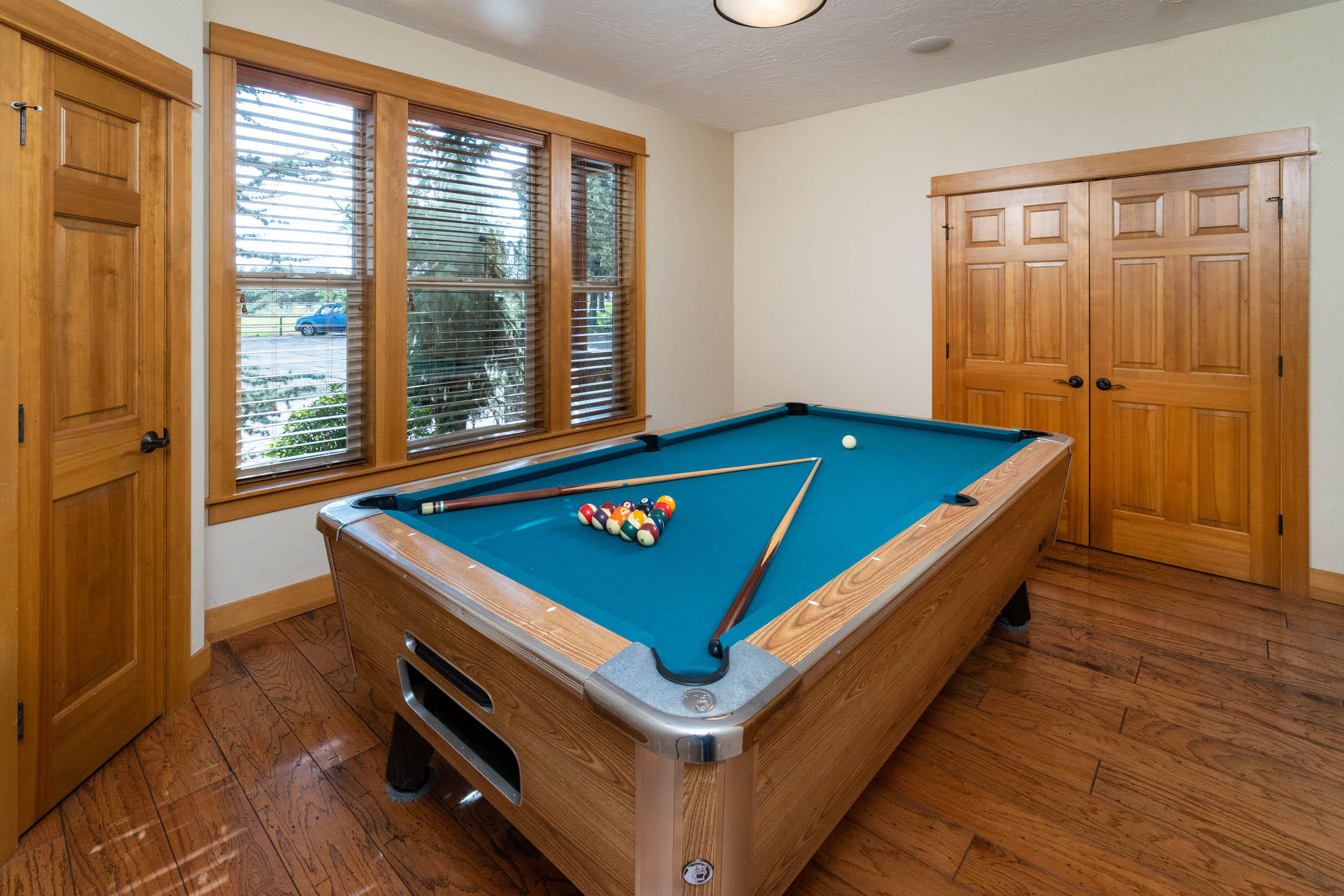 63575 Cricketwood Road Bend, OR 97701 - Photo 20 of 53 a room with pool table and windows