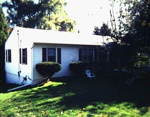 23 Barnum Road Danbury, CT 06811 - Photo 1 of 1 a backyard of a house with table and chairs