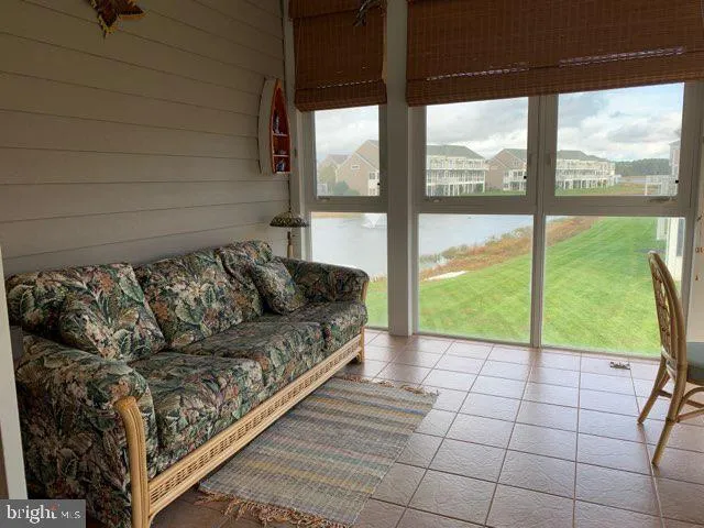 a view of a living room and a floor to ceiling window