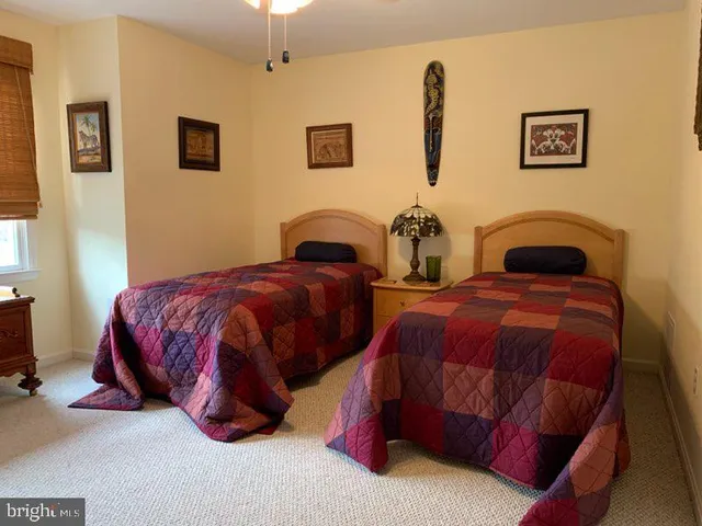 a bedroom with bed and a table