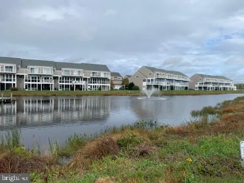 a view of a lake with building in front of house