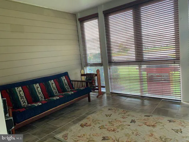 a view of a wooden deck with furniture