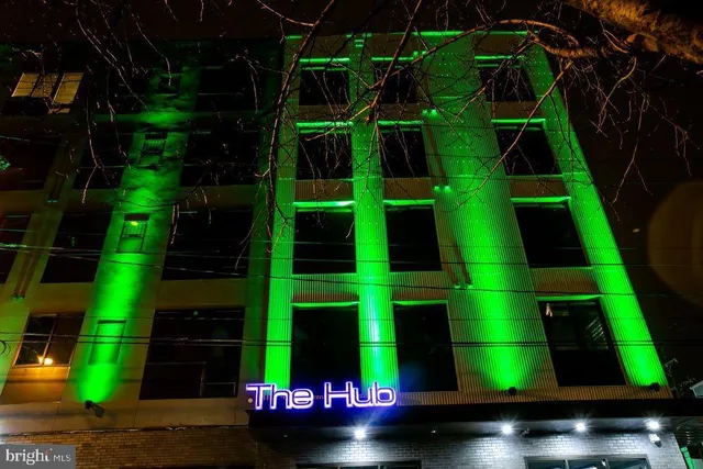 a view of a street with wooden benches