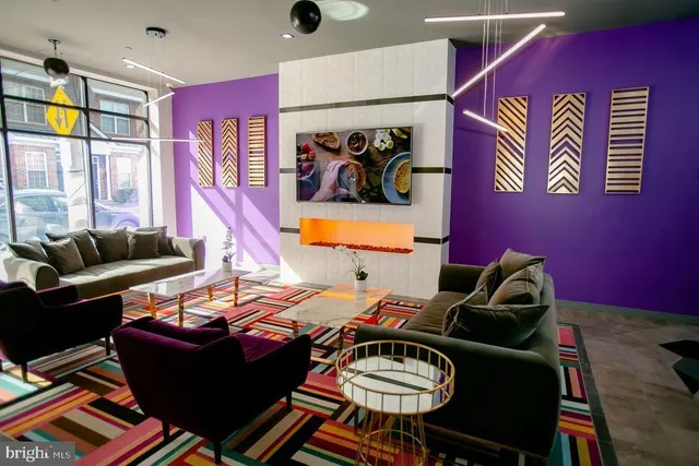 a living room with furniture and a rug