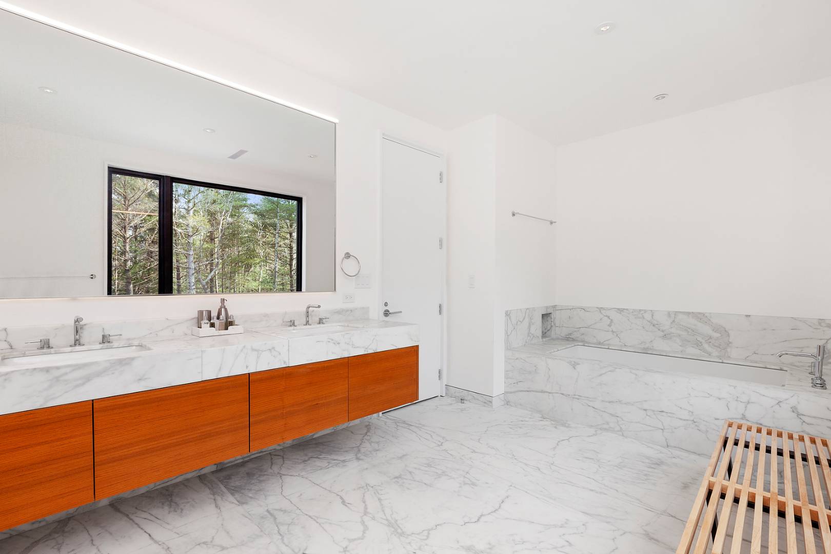 101 2 Holes Water Road East Hampton, NY 11937 - Photo 16 of 27 a bathroom with a tub sink and mirror