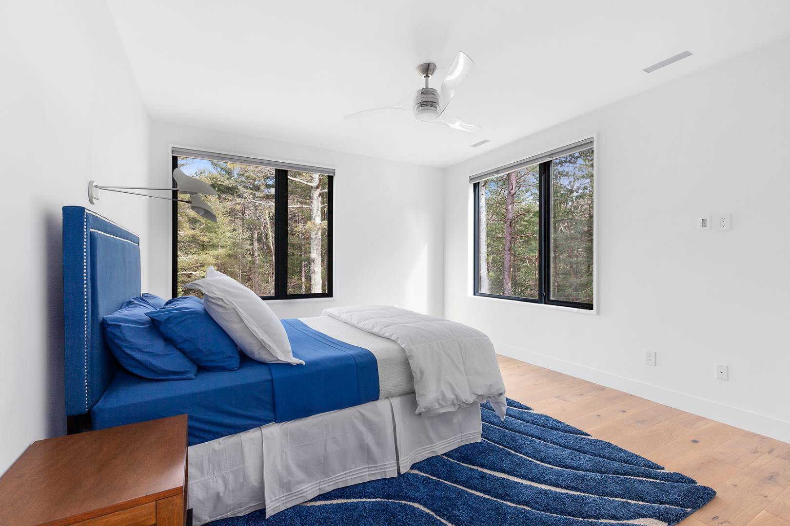 101 2 Holes Water Road East Hampton, NY 11937 - Photo 18 of 27 a bedroom with a bed and window