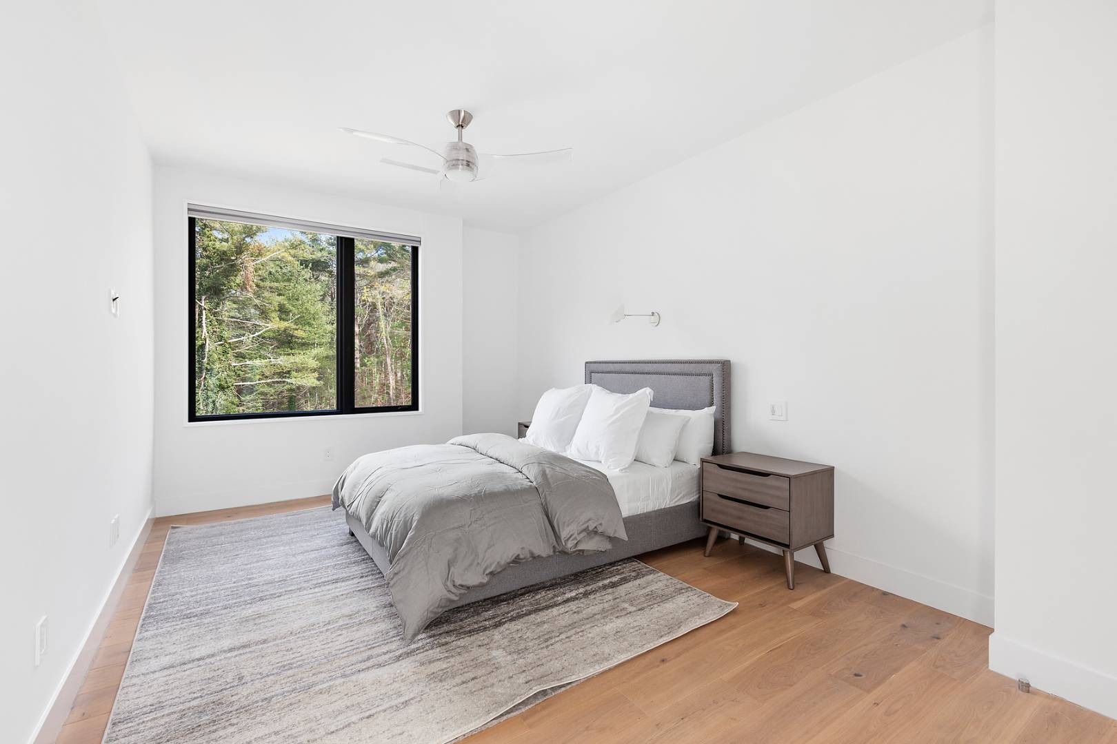 101 2 Holes Water Road East Hampton, NY 11937 - Photo 20 of 27 a bedroom with a bed and a window