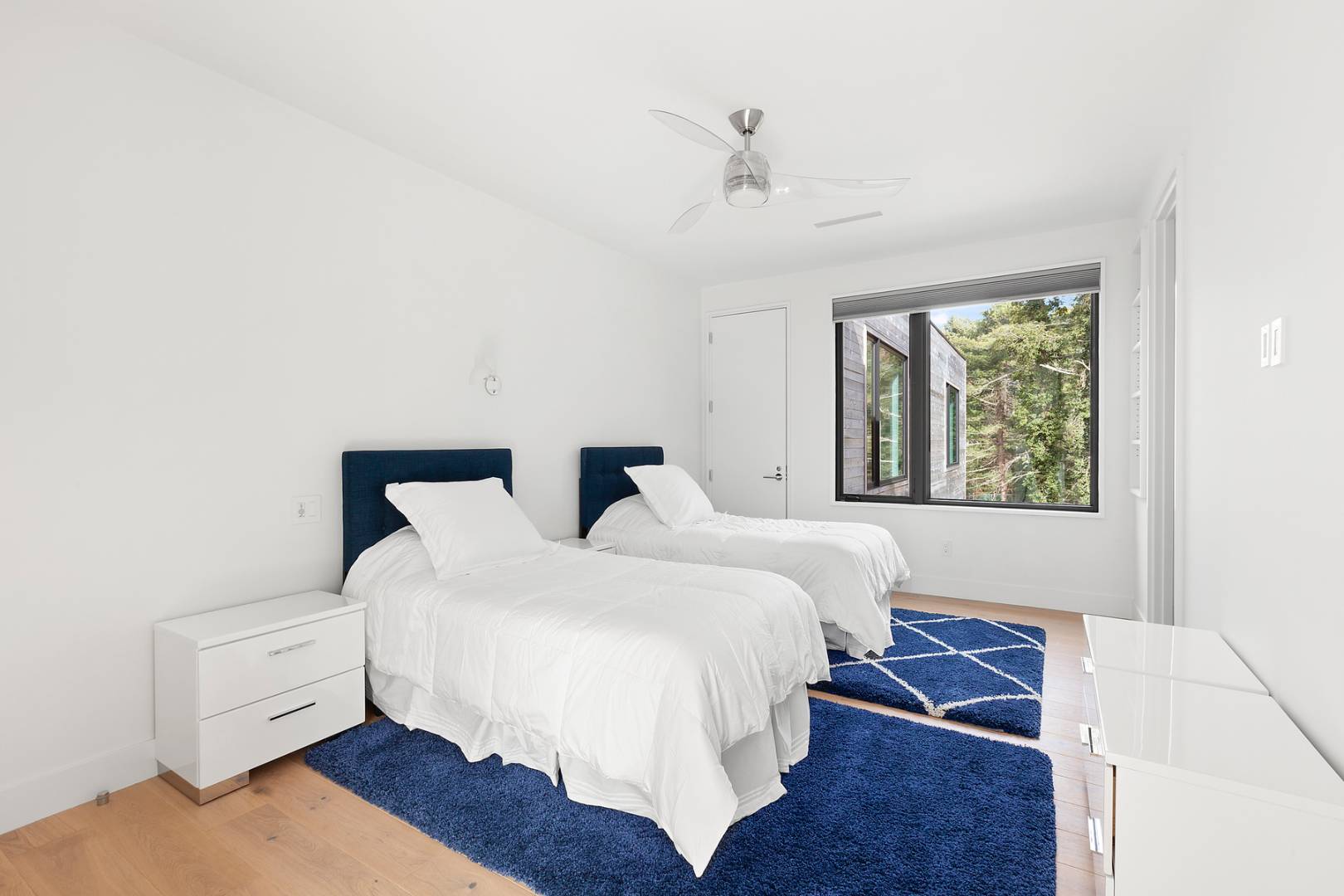 101 2 Holes Water Road East Hampton, NY 11937 - Photo 22 of 27 a bed room with a bed and a window