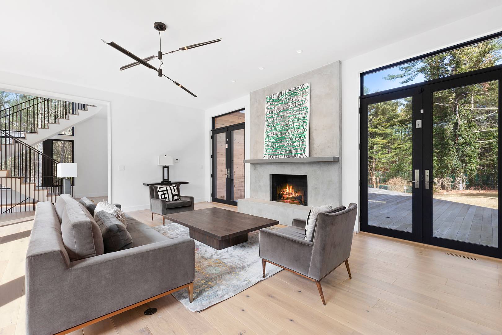 101 2 Holes Water Road East Hampton, NY 11937 - Photo 4 of 27 a living room with furniture and a fireplace