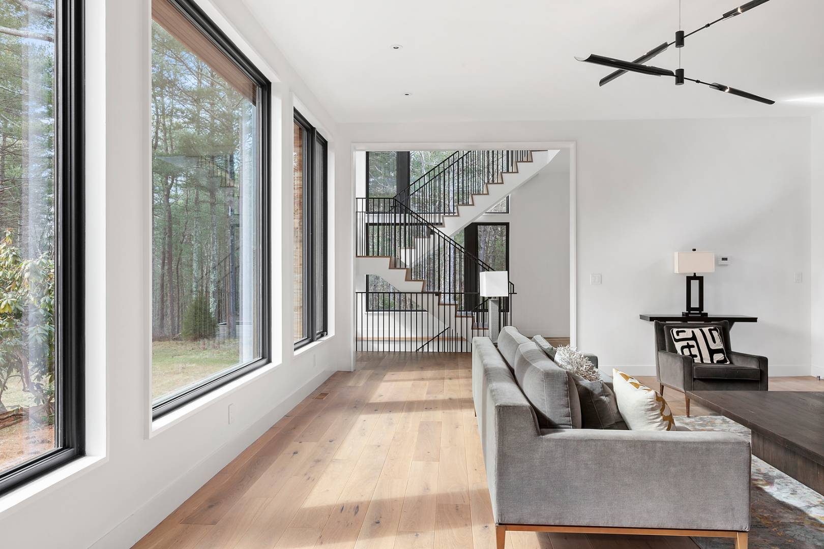 101 2 Holes Water Road East Hampton, NY 11937 - Photo 5 of 27 a living room with furniture and a glass door