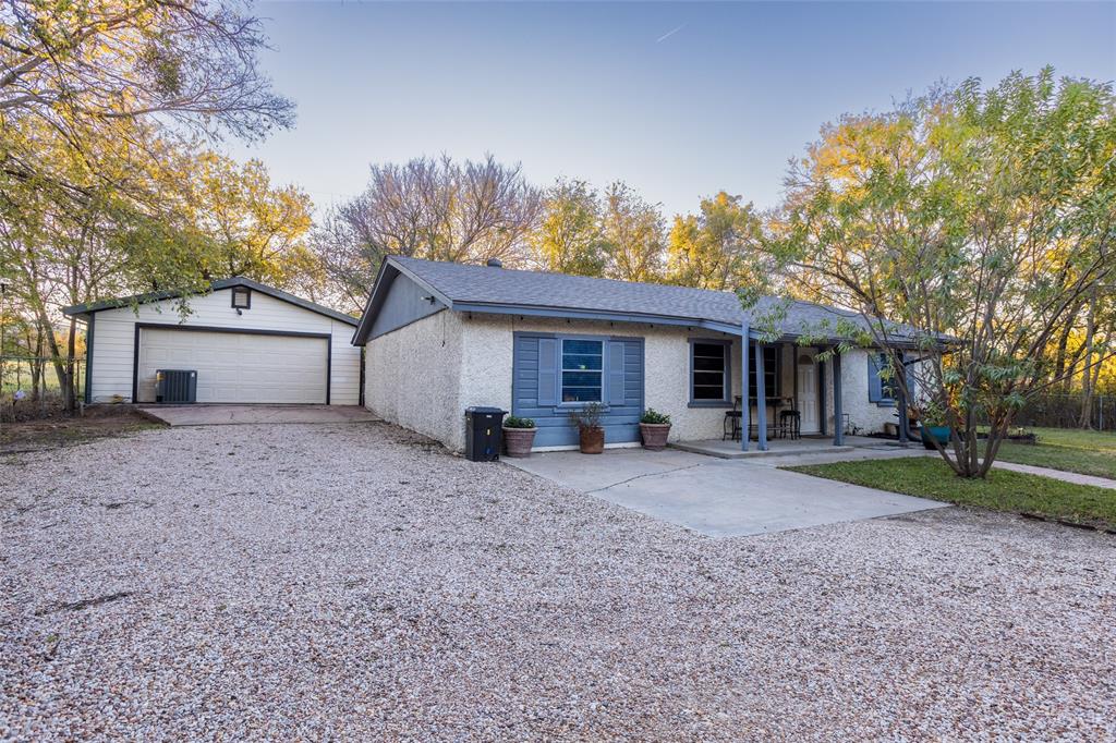 2401 West Bethesda Road Burleson, TX 76028 - Photo 2 of 12 a view of a house with a yard and large tree