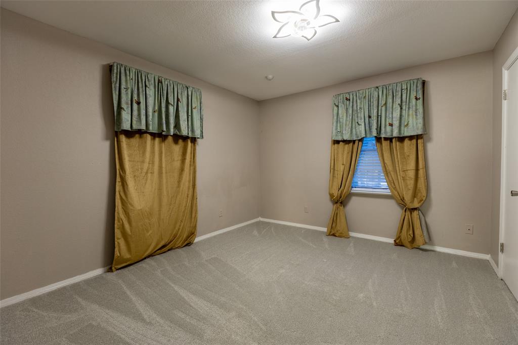 2401 West Bethesda Road Burleson, TX 76028 - Photo 4 of 12 an empty room with windows