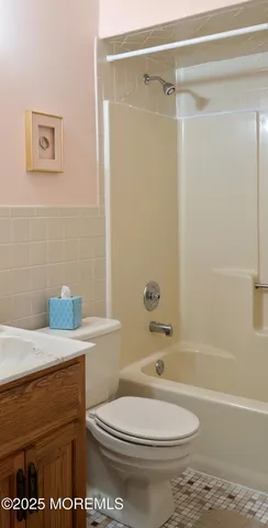 a bathroom with a sink a toilet and a bathtub