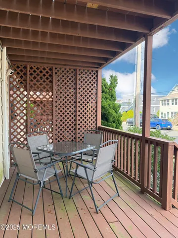 a view of a balcony with chairs