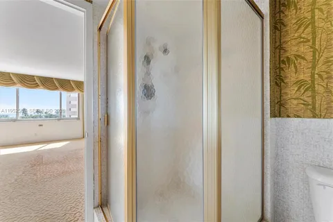 a bathroom with a bathtub and shower