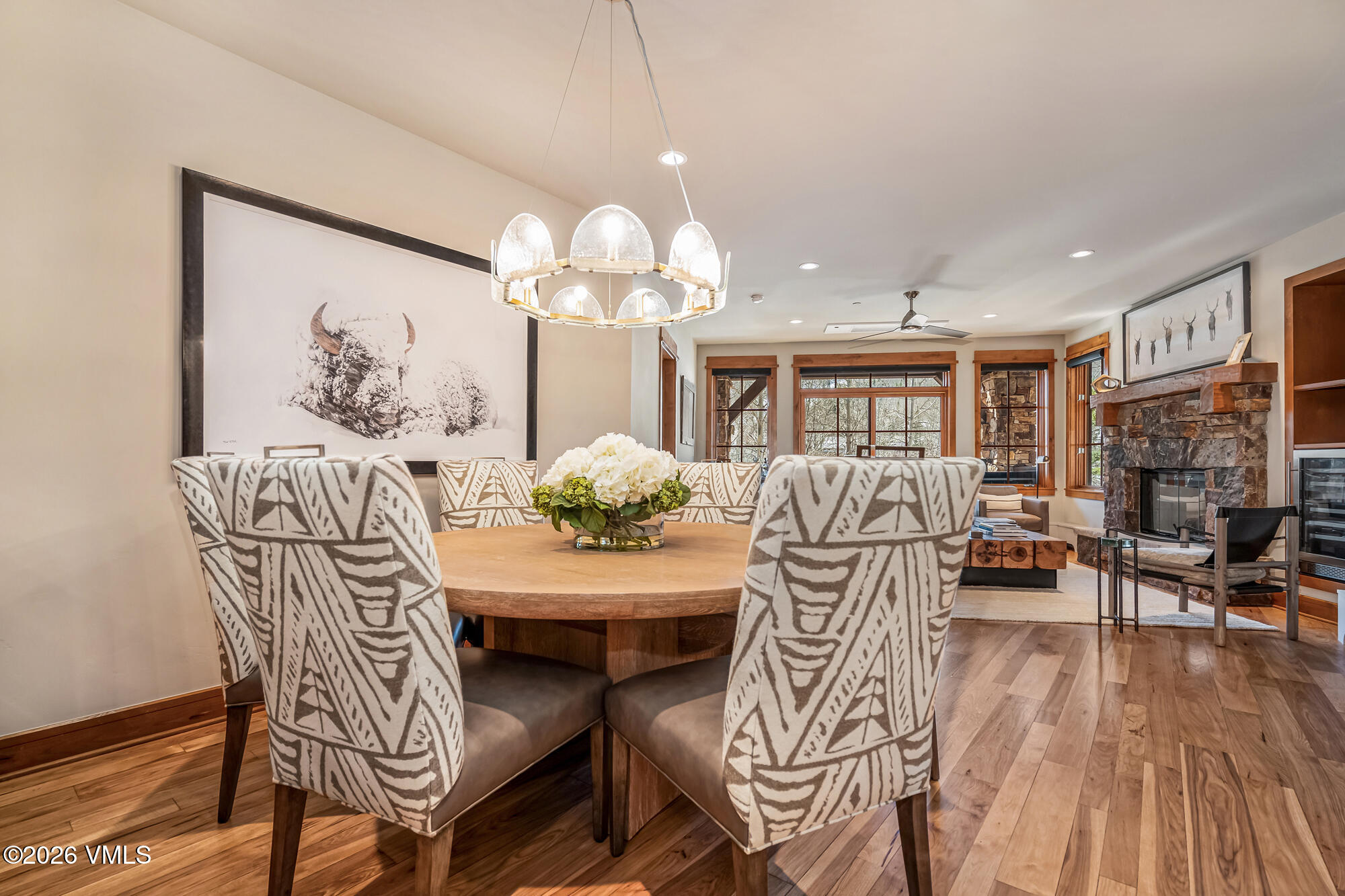 1087 Bachelor Ridge Road, Unit 205 Avon, CO 81620 - Photo 13 of 45 a view of a dining room with furniture and wooden floor