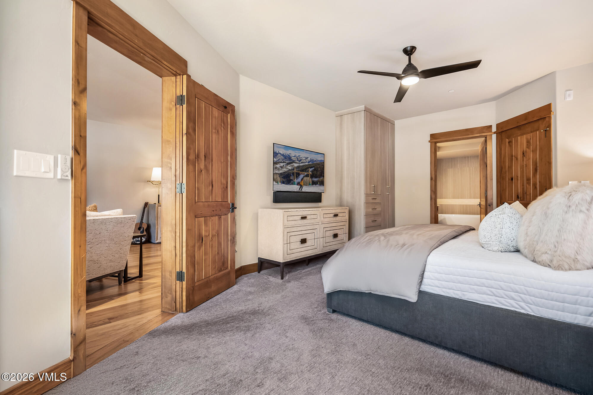 1087 Bachelor Ridge Road, Unit 205 Avon, CO 81620 - Photo 21 of 45 a bedroom with a bed and a large mirror