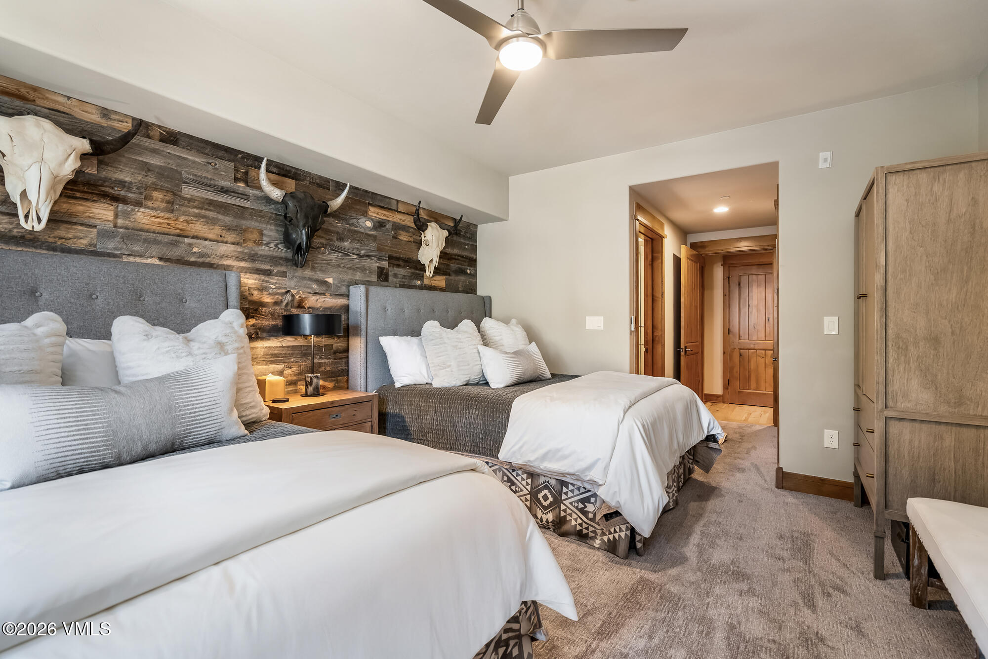 1087 Bachelor Ridge Road, Unit 205 Avon, CO 81620 - Photo 25 of 45 a bedroom with two beds and painted walls