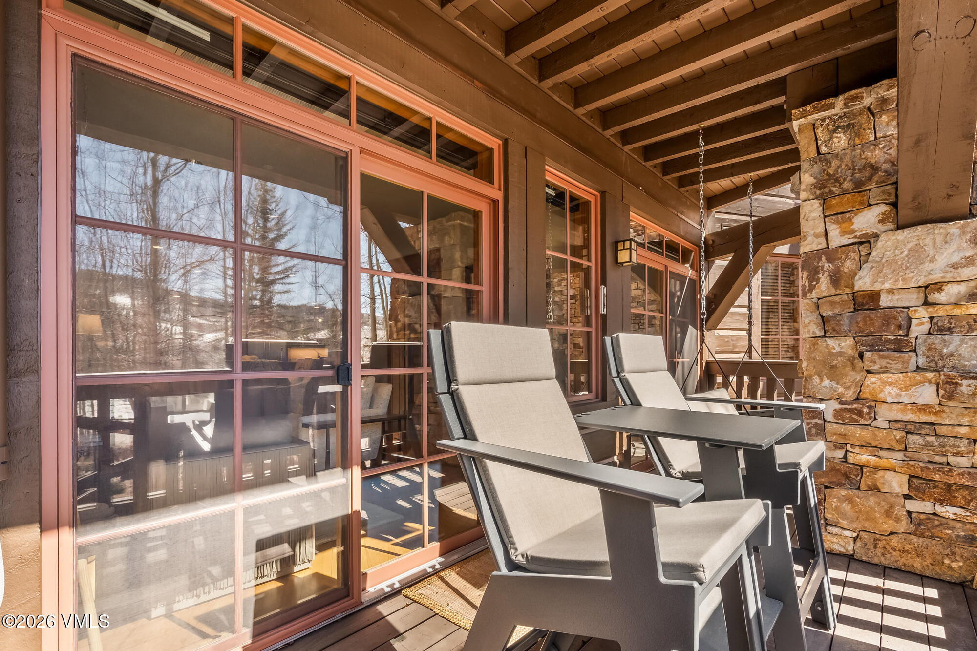 1087 Bachelor Ridge Road, Unit 205 Avon, CO 81620 - Photo 30 of 46 a view of a chairs and table in the balcony
