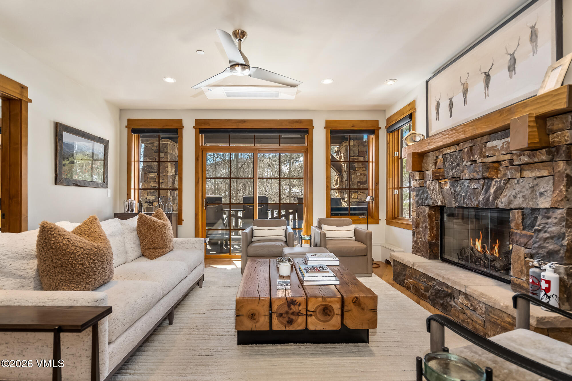 1087 Bachelor Ridge Road, Unit 205 Avon, CO 81620 - Photo 3 of 46 a living room with furniture and a fireplace