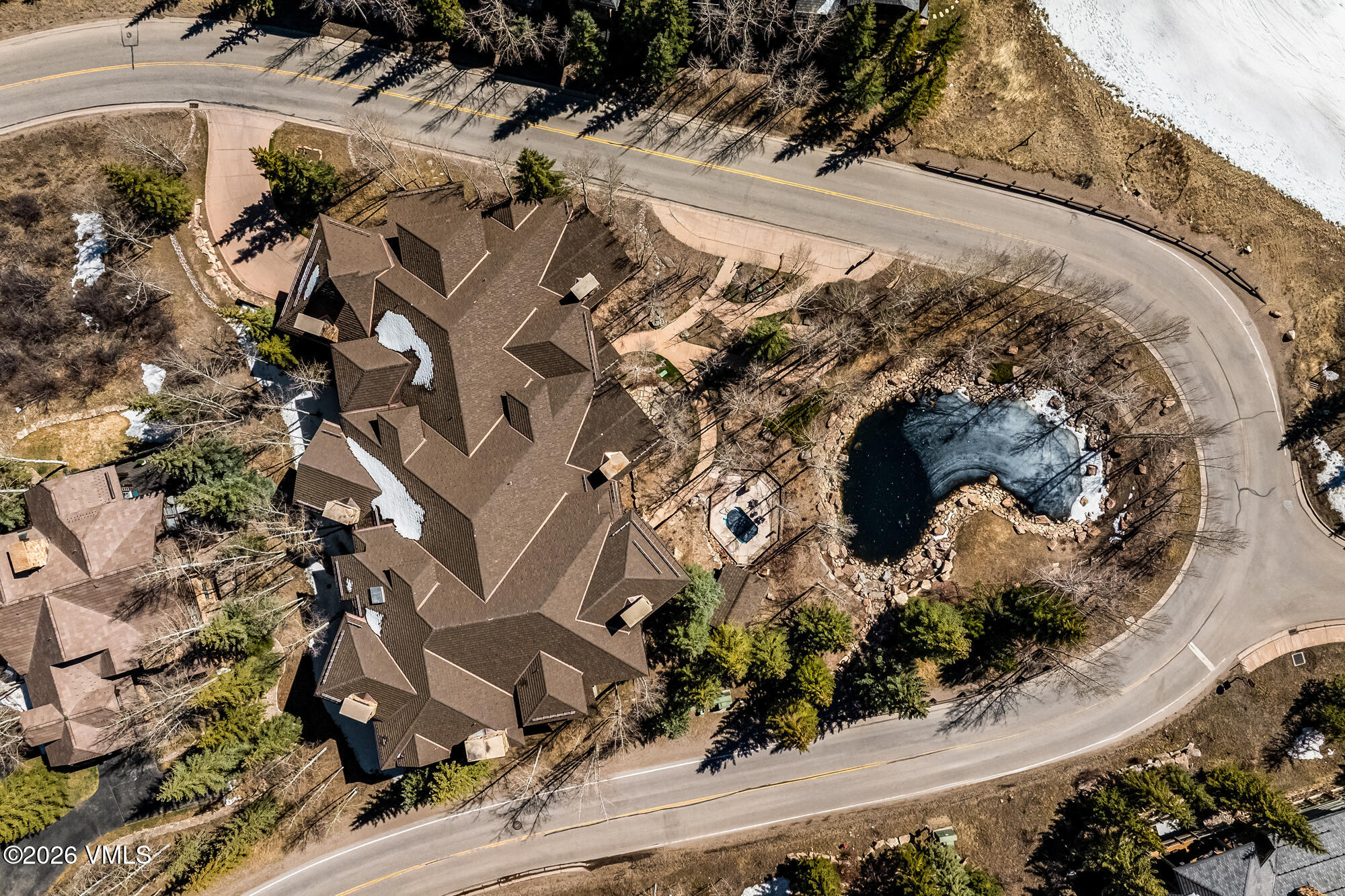 1087 Bachelor Ridge Road, Unit 205 Avon, CO 81620 - Photo 39 of 45 an aerial view of a house with a yard