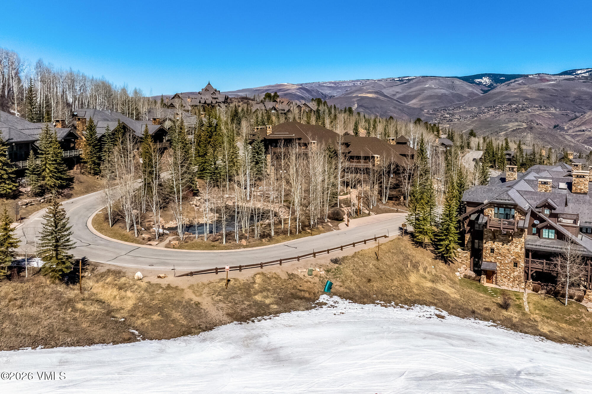 1087 Bachelor Ridge Road, Unit 205 Avon, CO 81620 - Photo 40 of 46 a view of a swimming pool with a yard