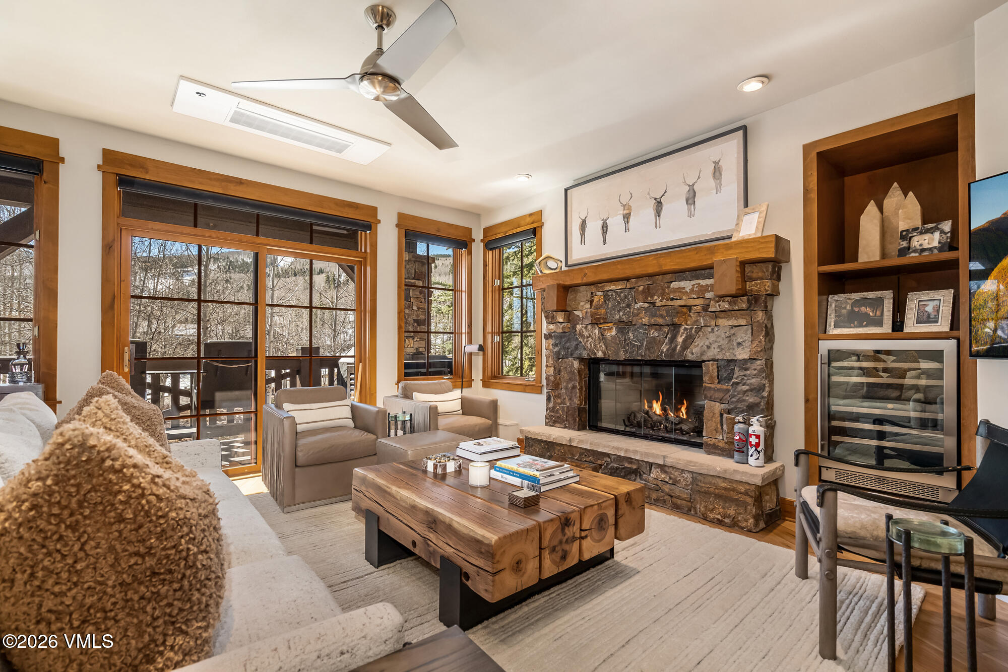 1087 Bachelor Ridge Road, Unit 205 Avon, CO 81620 - Photo 4 of 46 a living room with furniture and a fireplace