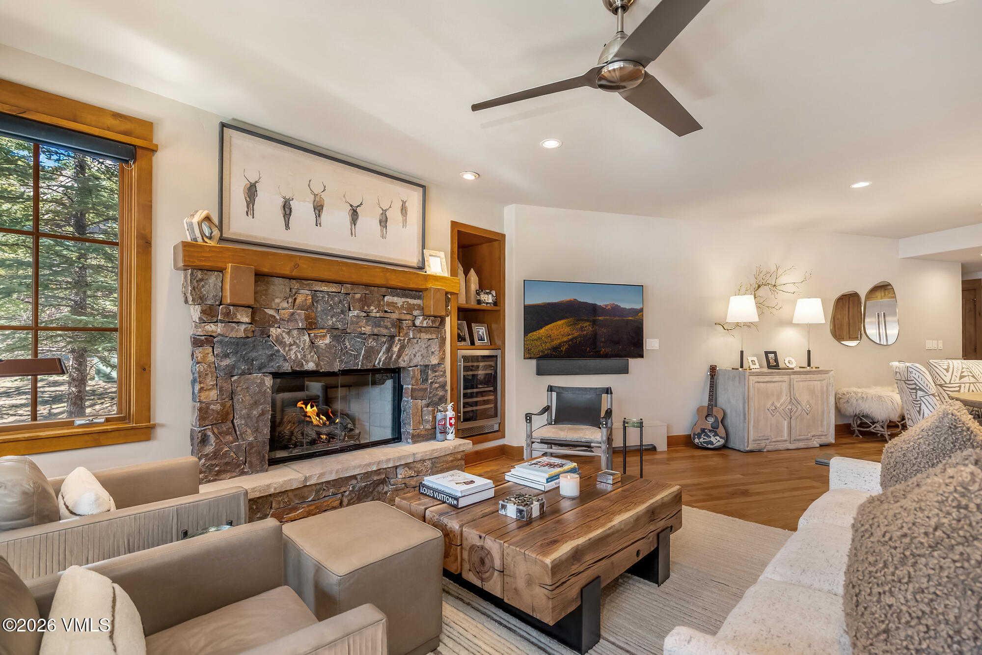 1087 Bachelor Ridge Road, Unit 205 Avon, CO 81620 - Photo 5 of 46 a living room with furniture and a fireplace