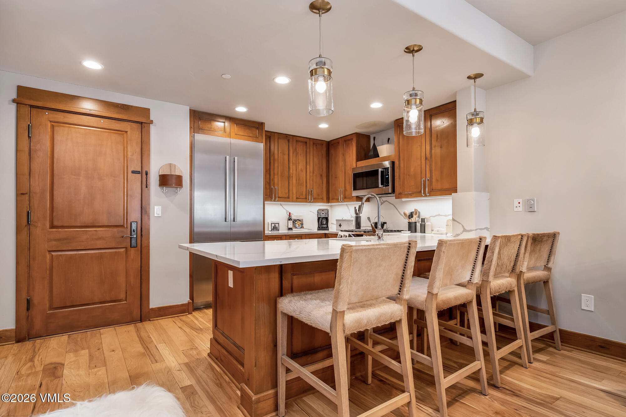 1087 Bachelor Ridge Road, Unit 205 Avon, CO 81620 - Photo 6 of 46 a large kitchen with a table and chairs