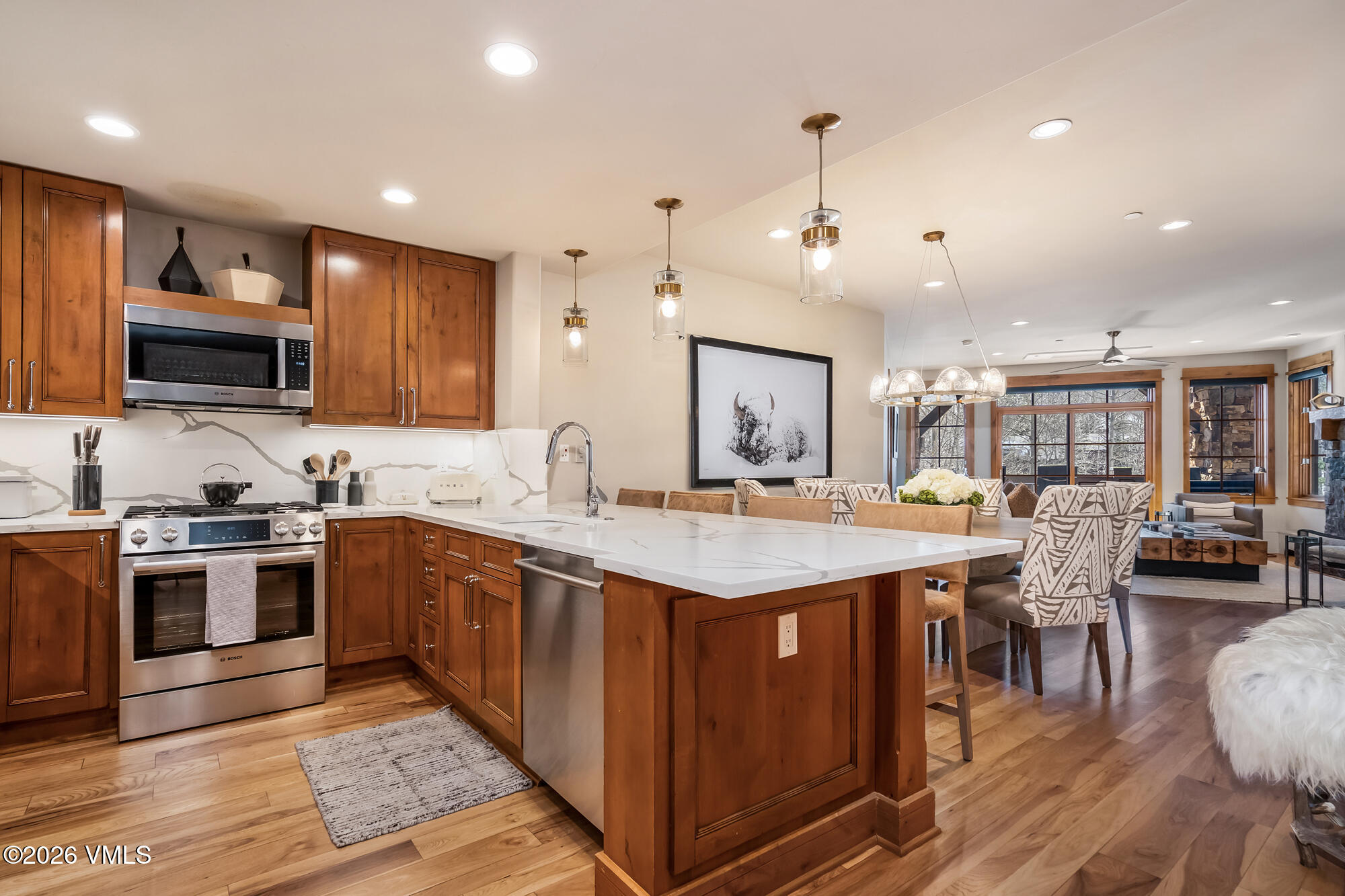 1087 Bachelor Ridge Road, Unit 205 Avon, CO 81620 - Photo 9 of 46 a open kitchen with stainless steel appliances granite countertop a stove and cabinets