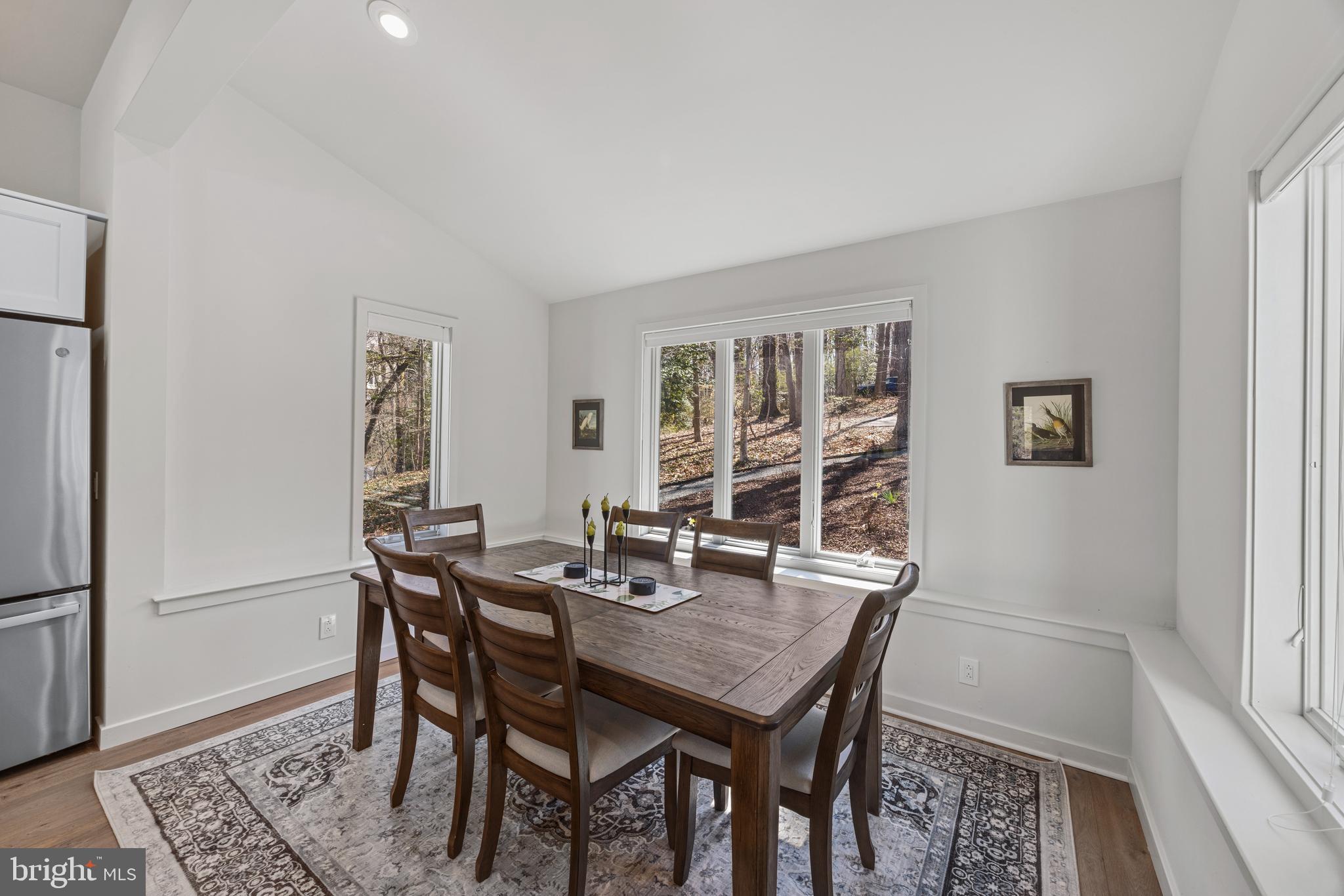 378 Forest Beach Road Annapolis, MD 21409 - Photo 14 of 42 a view of a dining room with furniture and window