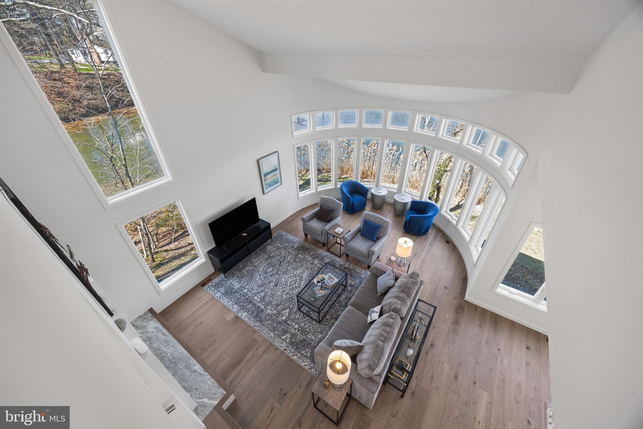 378 Forest Beach Road Annapolis, MD 21409 - Photo 18 of 42 a living room with furniture and a table
