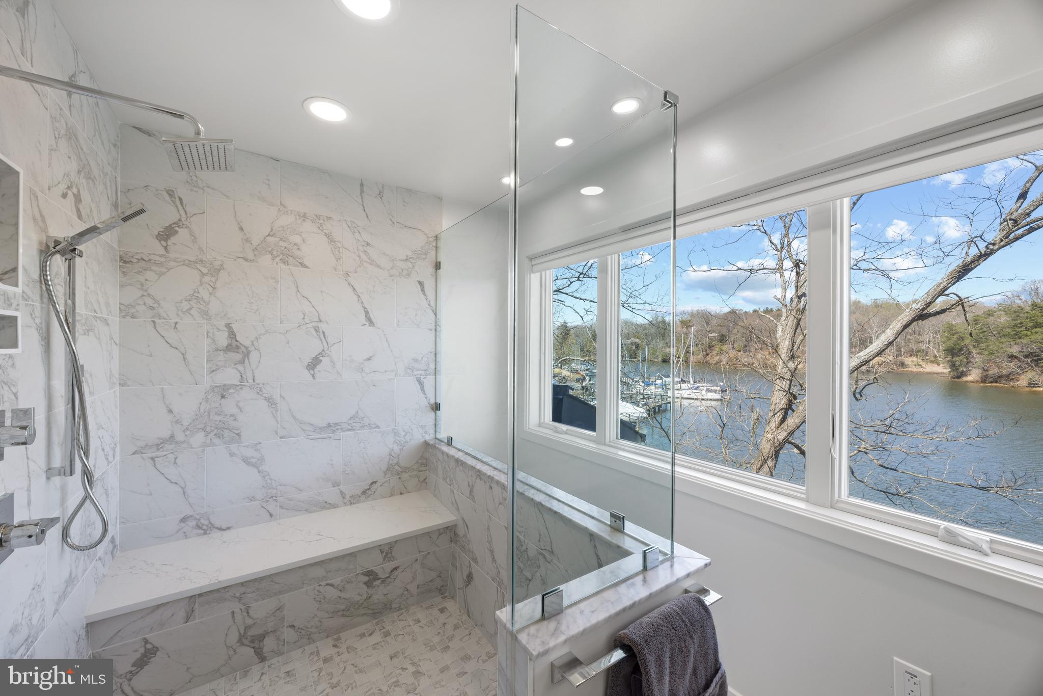 378 Forest Beach Road Annapolis, MD 21409 - Photo 26 of 42 a bathroom with a bathtub and a shower