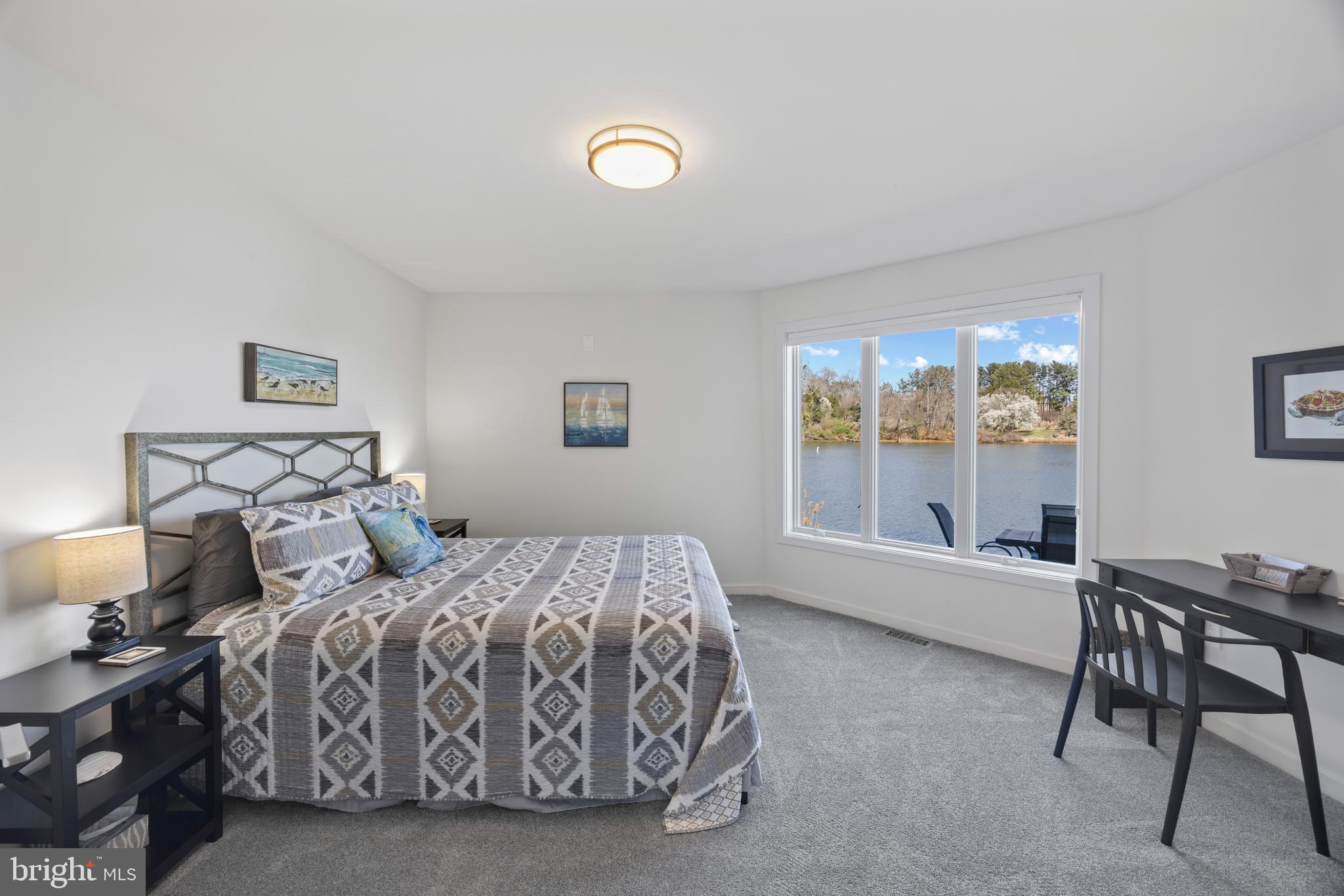 378 Forest Beach Road Annapolis, MD 21409 - Photo 29 of 42 a bed room with a bed and a chair