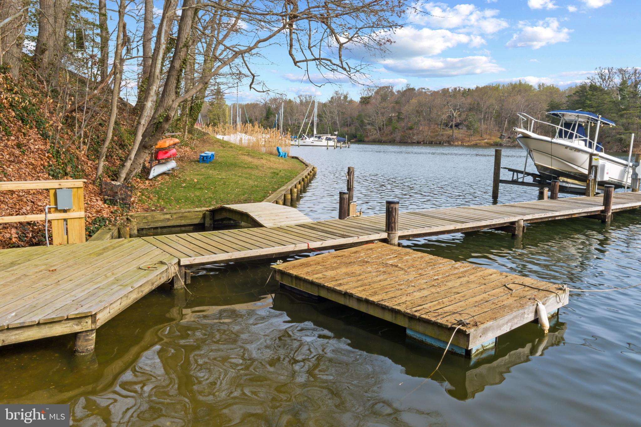378 Forest Beach Road Annapolis, MD 21409 - Photo 37 of 42 a view of a lake with chairs
