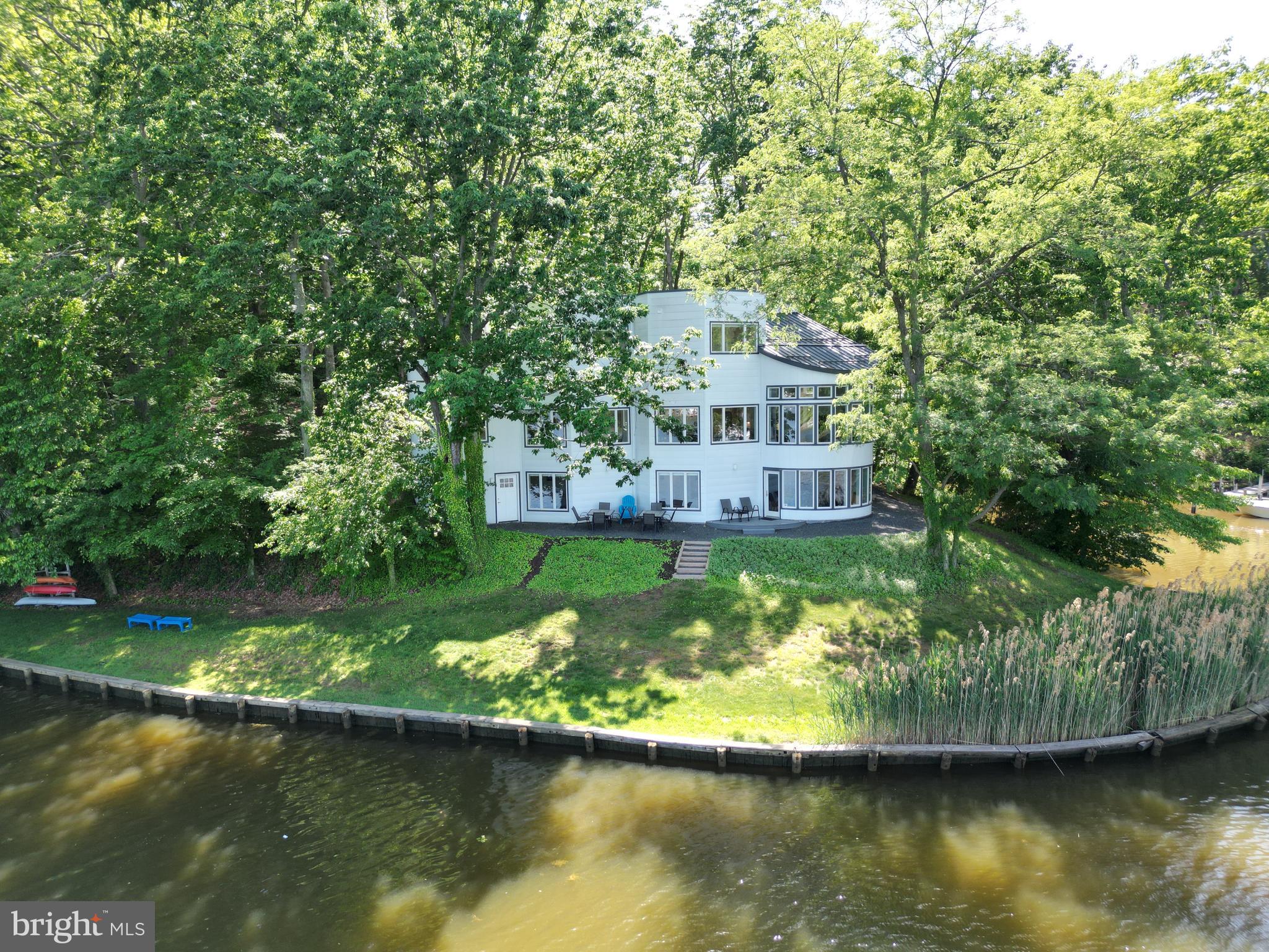 378 Forest Beach Road Annapolis, MD 21409 - Photo 39 of 42 a view of a house with a large pool and a yard