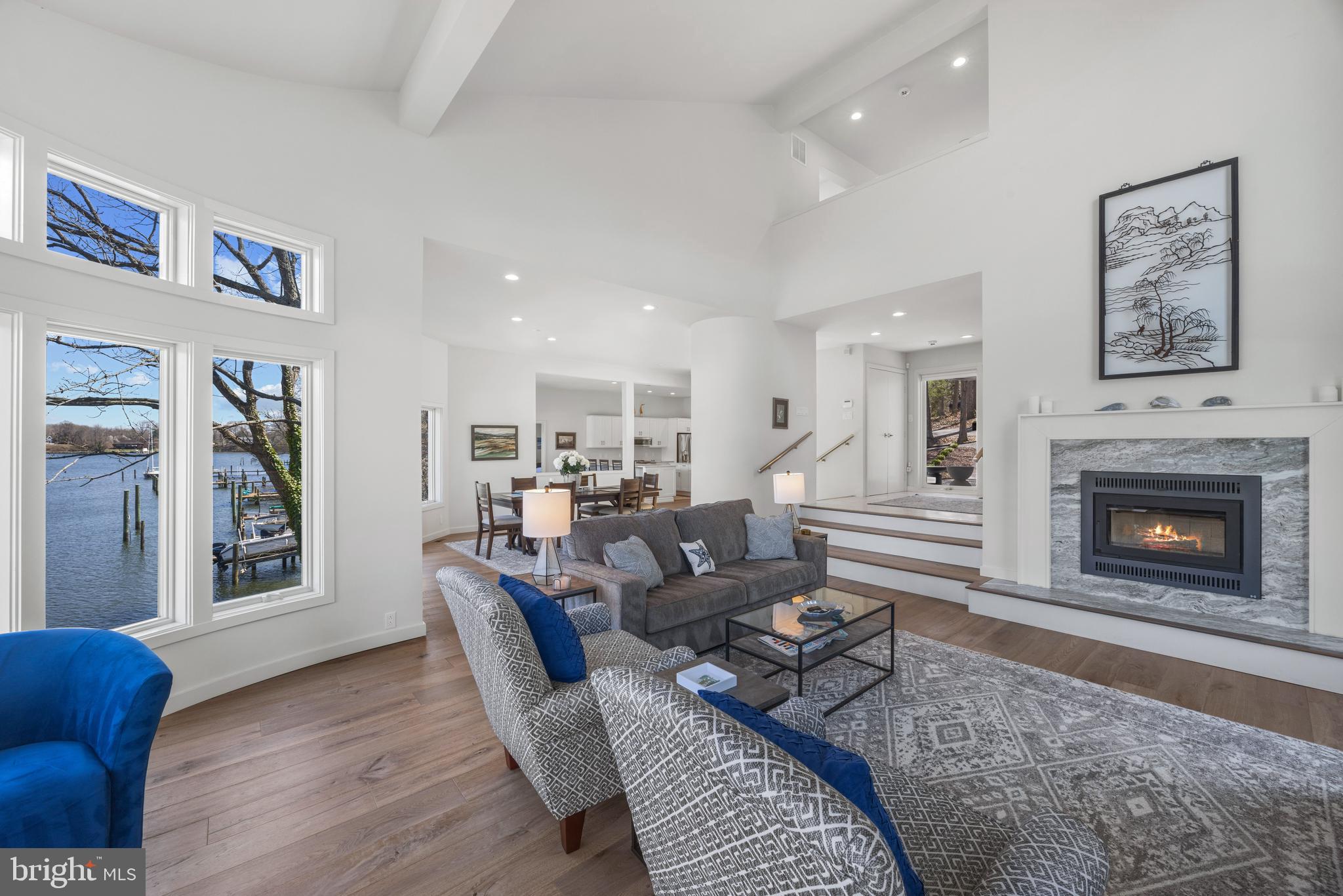 378 Forest Beach Road Annapolis, MD 21409 - Photo 9 of 42 a living room with furniture and a fireplace