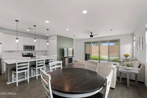 a large kitchen with a table and chairs