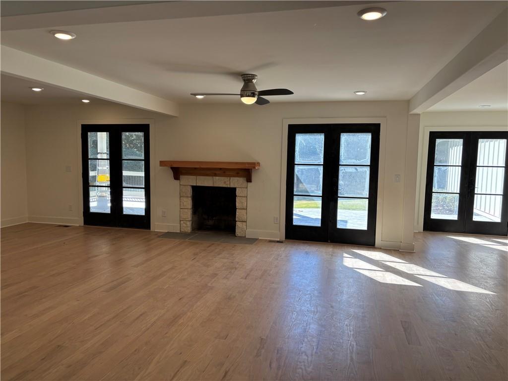 680 Brookfield Parkway Roswell, GA 30075 - Photo 5 of 15 an empty room with windows and fireplace