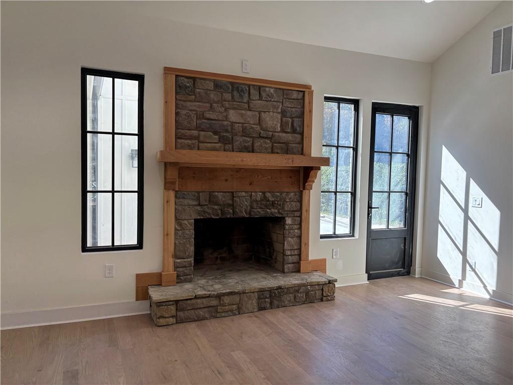680 Brookfield Parkway Roswell, GA 30075 - Photo 7 of 15 a living room with furniture and a fireplace