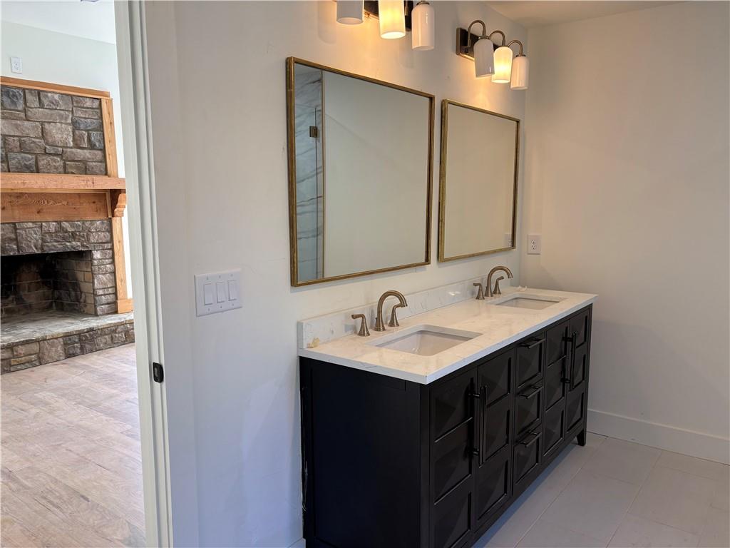 680 Brookfield Parkway Roswell, GA 30075 - Photo 8 of 15 a bathroom with a double vanity sink and mirror