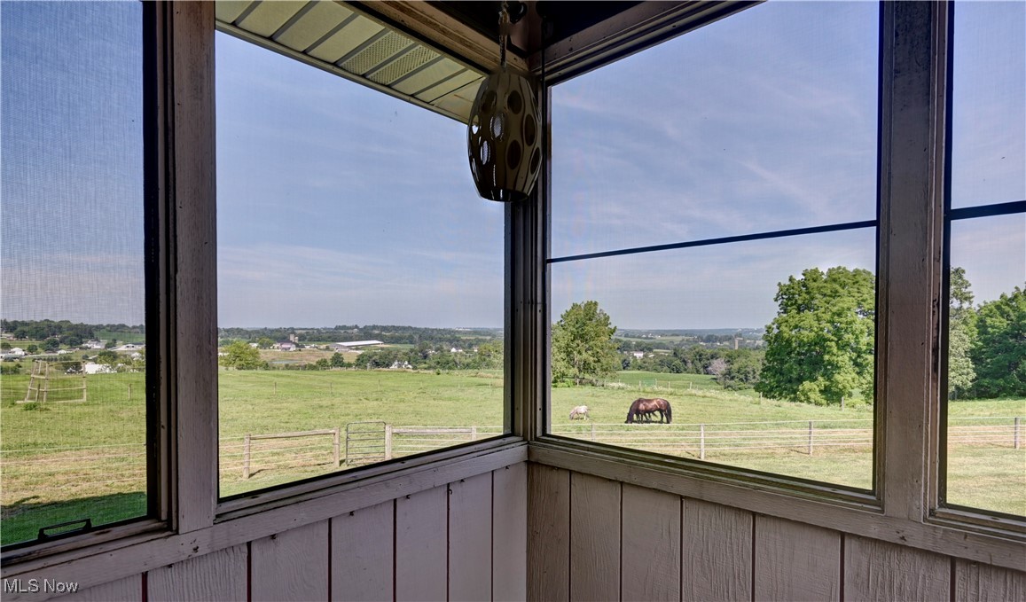 17198 Harrison Road Navarre, OH 44662 - Photo 29 of 45 Unfurnished sunroom with a rural view and healthy amount of natural light