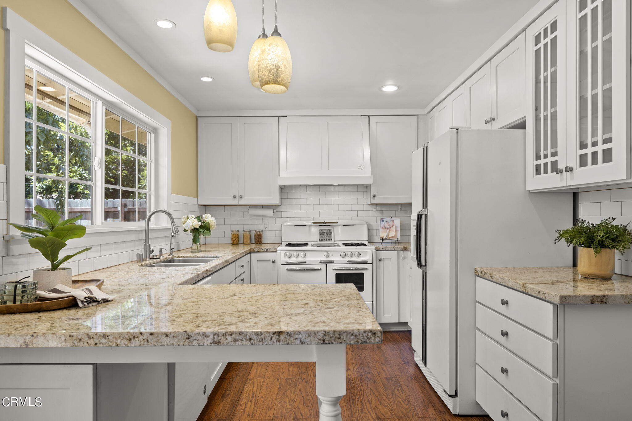 320 Cruzero Street Ojai, CA 93023 - Photo 15 of 48 a kitchen with granite countertop a sink stove and refrigerator