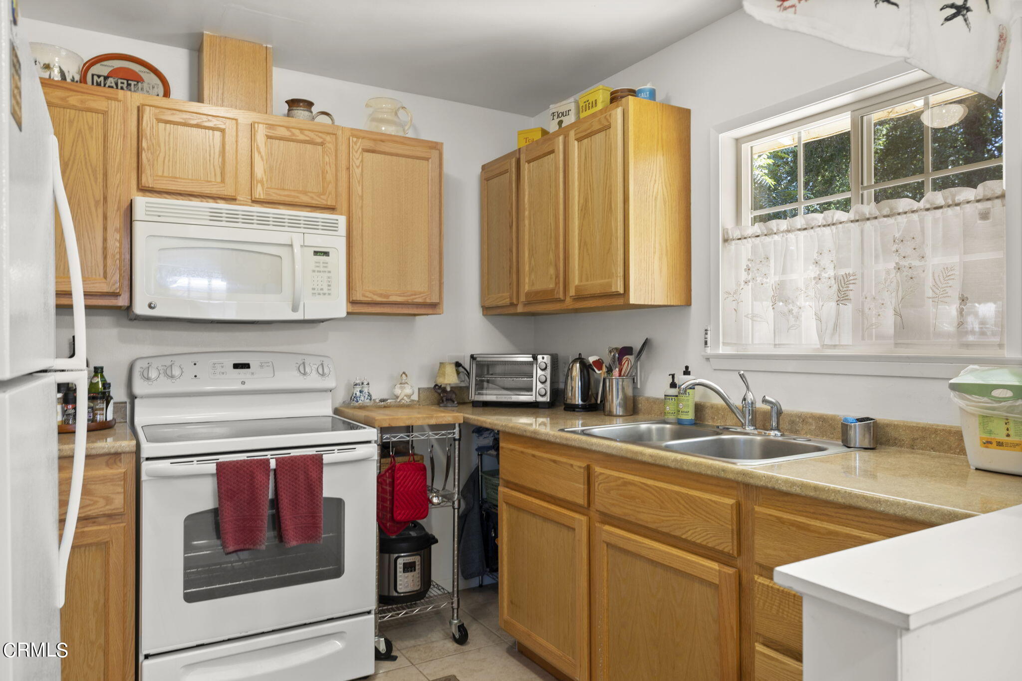 320 Cruzero Street Ojai, CA 93023 - Photo 38 of 48 a kitchen with a sink cabinets and appliances