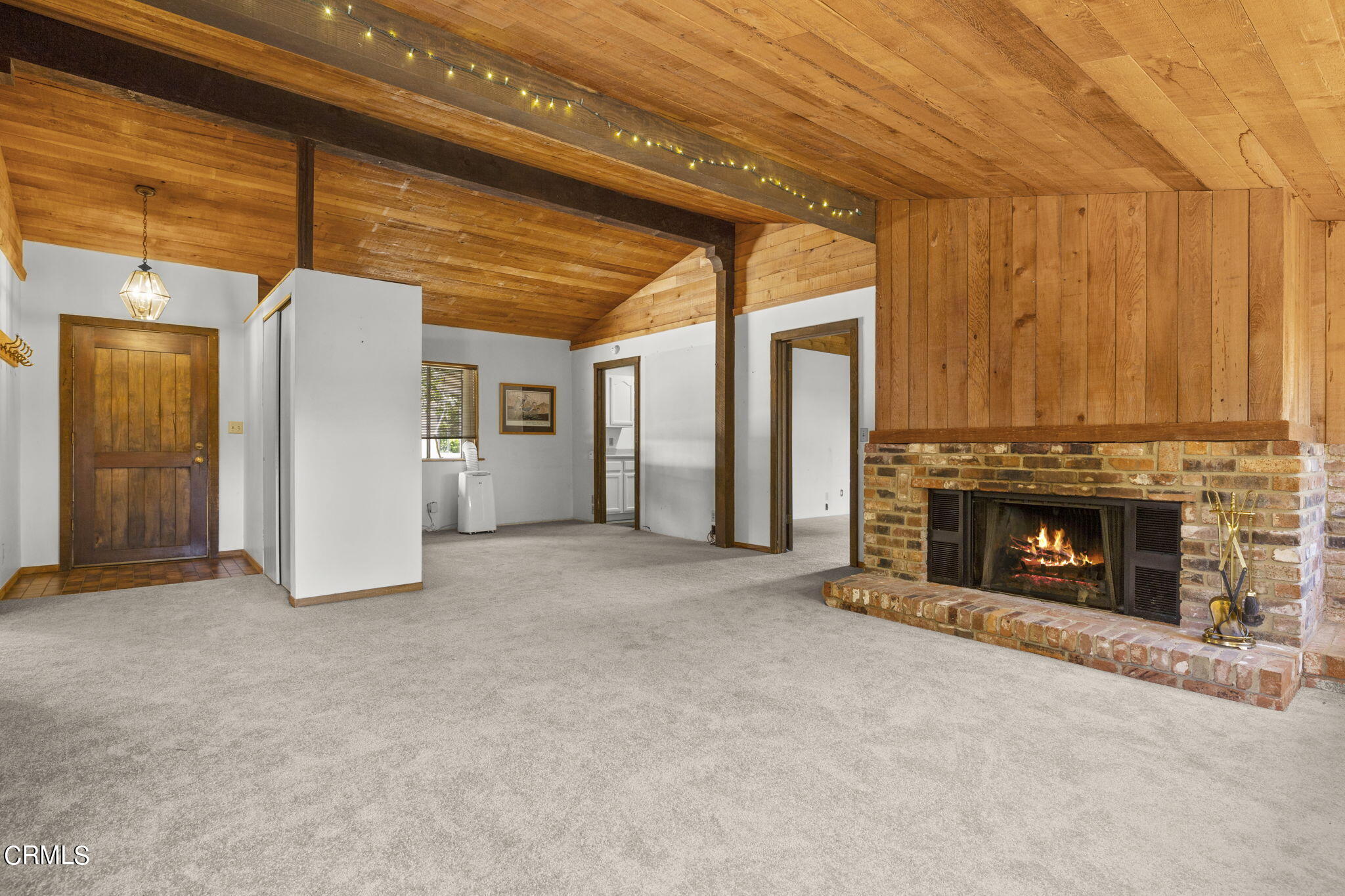 320 Cruzero Street Ojai, CA 93023 - Photo 8 of 48 an empty room with a fireplace and window