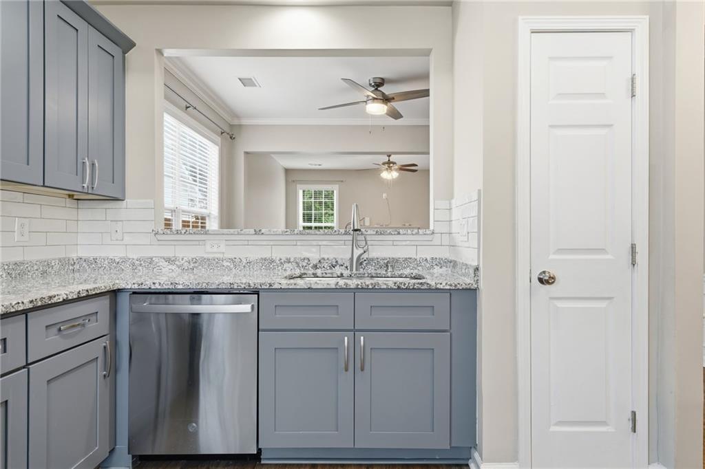 1527 Anna Ruby Lane Kennesaw, GA 30152 - Photo 16 of 42 a bathroom with a granite countertop sink and a mirror