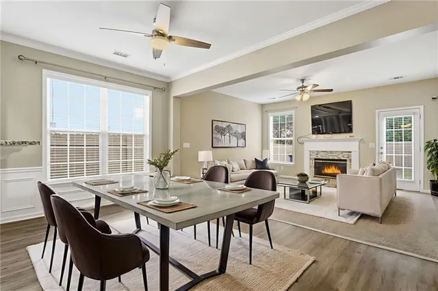 a view of a dining room with furniture window and wooden floor